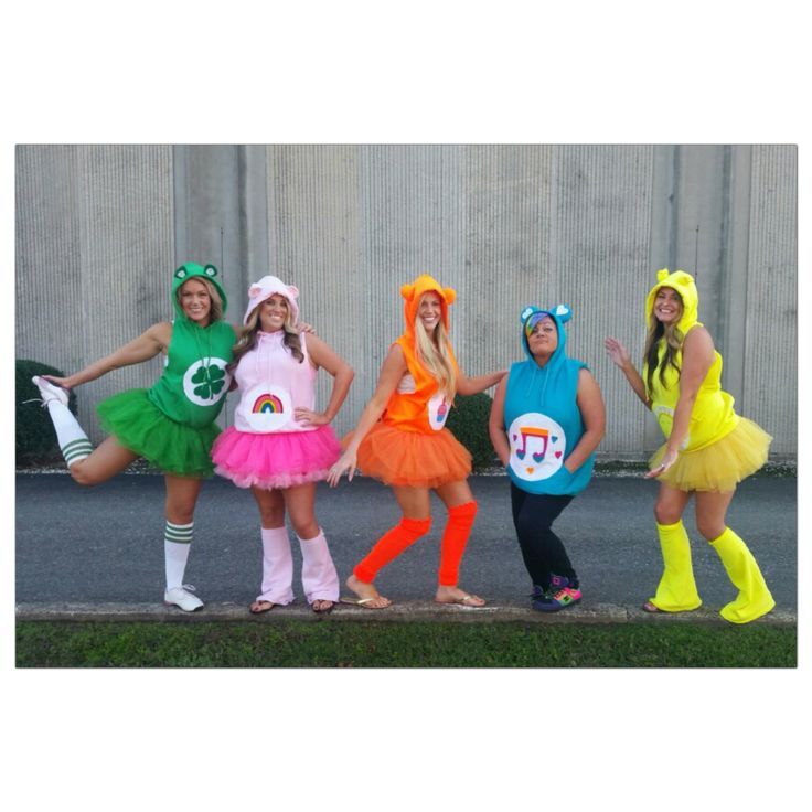 four girls dressed in costumes posing for the camera