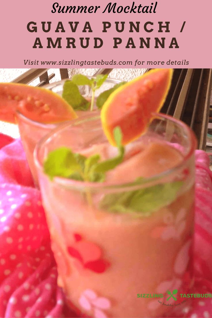 a pink drink sitting on top of a table