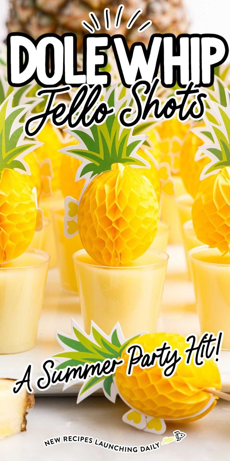 the pineapples are in small cups with yellow paper balls on them, and one is