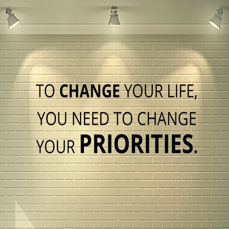 a white brick wall with the words to change your life, you need to change your priorities