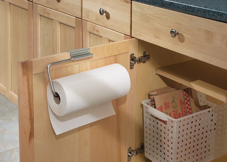 a magazine cover with a roll of toilet paper hanging on the wall and a basket in front of it