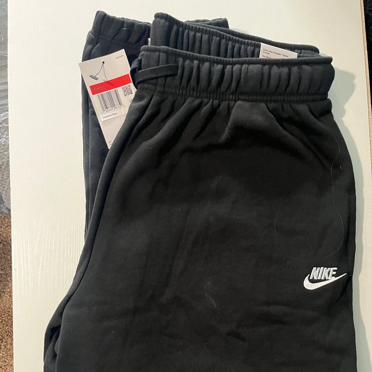 Women’”S Mid-Rise Oversized Sweatpants Black Fleece Sweats With Ribbed Waistband, Black Sports Sweats With Pockets, Black Sweats With Pockets For Sports, Nike Sports Bottoms For Fall, Nike Joggers For Winter Sports, Nike Sporty Sweatpants For Fall, Nike Sporty Bottoms For Fall, Nike Winter Joggers For Sports, Comfortable Nike Sweatpants For Sports