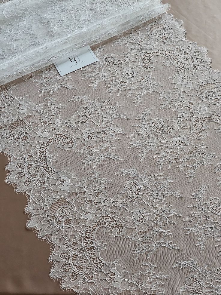 Quantity available. Please "Add to cart" to see available quantity. Ivory soft lace trimming. This lace is also available in black color. Please ask about black color. Both sides scalloped. Width: 50 cm/19.7 inches Item number: WDL6012 Made in Europe www.LaceToLove.com Price is set for one meter/yard.  You will receive the fabric in one continuous piece if you purchase more than 1 meter/yard. IMPORTANT! Maximum one piece length of this lace trimming is 3 meters/yards. If you buy more than 3 mete Elegant Scalloped Lace For Brides, Wedding Night Lace Dress With Lace Back, White Scalloped Lace Dress For Wedding Night, Wedding Lace Dress With Lace Back, White Lace Wedding Dress With Lace Back, White Lace Back Dress For Wedding, Lace Wedding Dress With Lace Trim For Bride, Cream Lace Dress With Delicate Details, White Lace Patchwork Dress For Ceremony