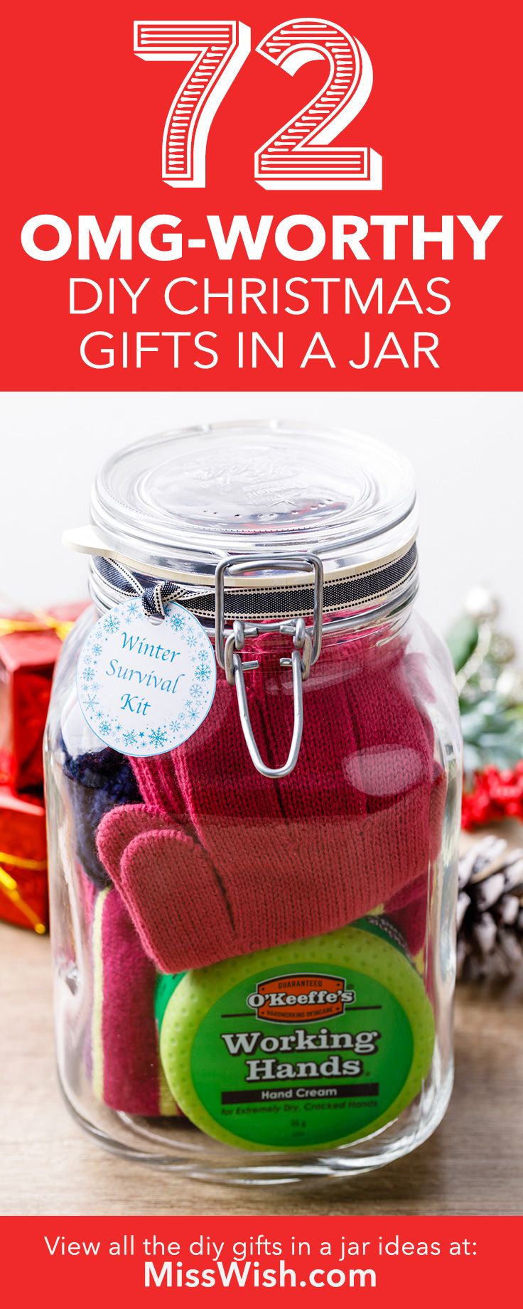 a glass jar filled with christmas gifts on top of a wooden table