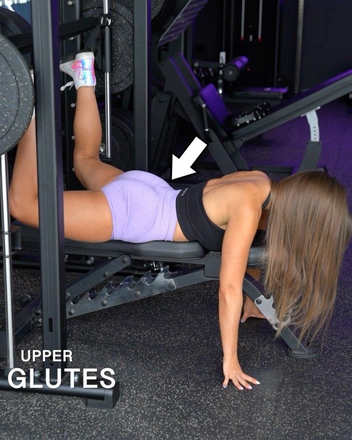 a woman doing push ups on a bench in a gym with the words upper glutes above her