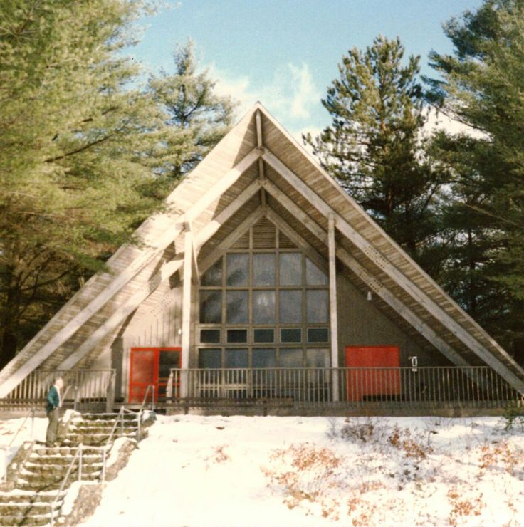 a large building with stairs leading up to it and snow on the ground around it