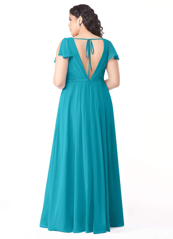 a woman in a long blue dress looking back