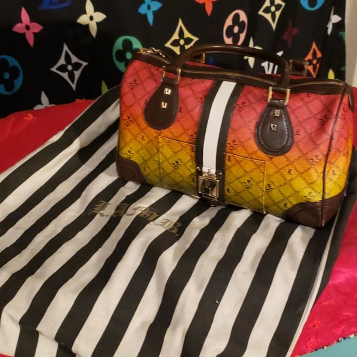 Rare Hard To Find L.A.M.B Rasta Bag. Comes With Dust Bag. Super Cute Great For Any Collection. There Are A Few Teeny Tiny Scuffs On Bottom Of Bag But Nothing Major. Still In Excellent Condition. I Never Used It. Awesome Rasta Bag From Gwen Stephanies Line L.A.M.B Multicolor Satchel With Detachable Strap For Errands, Designer Multicolor Travel Bags, Designer Multicolor Bags For Errands, Designer Multicolor Bags For Everyday Use, Multicolor Travel Bags With Branded Hardware, Travel Bags With Branded Hardware In Multicolor, Luxury Multicolor Satchel For Travel, Designer Multicolor Satchel For Travel, Designer Multicolor Shoulder Bag