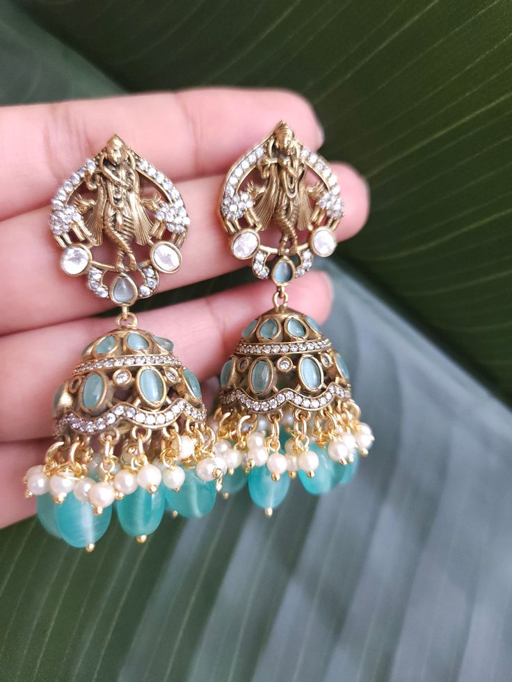 Fine Victorian Kundan Jhumka with CZ stones and uncut Polki Kundan stones Surely a statement Jhumka earringThe earring has very fine quality and craftmanship and also has a very elegant look pictures cannot do justice to how beautiful this jhumka earrings is . Length 2.5 inches Festive Peacock Design Earrings For Reception, Kundan Jhumkas For Reception, Chandbali Jhumkas For Reception, Blue Stone Work Temple Jewelry Earrings, Stone Work Drop Jhumkas For Reception, Stone Work Jhumkas For Reception, Heavy Kundan Jhumkas Drop Earrings, Kundan Earrings With Peacock Design For Navratri, Navratri Kundan Earrings With Peacock Design