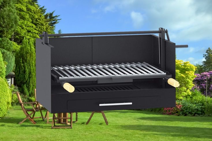 an outdoor bbq grill sitting in the grass