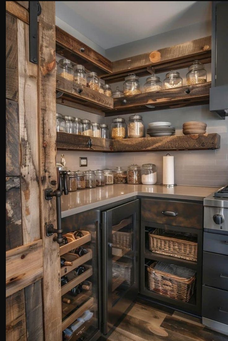 a kitchen filled with lots of wooden shelves