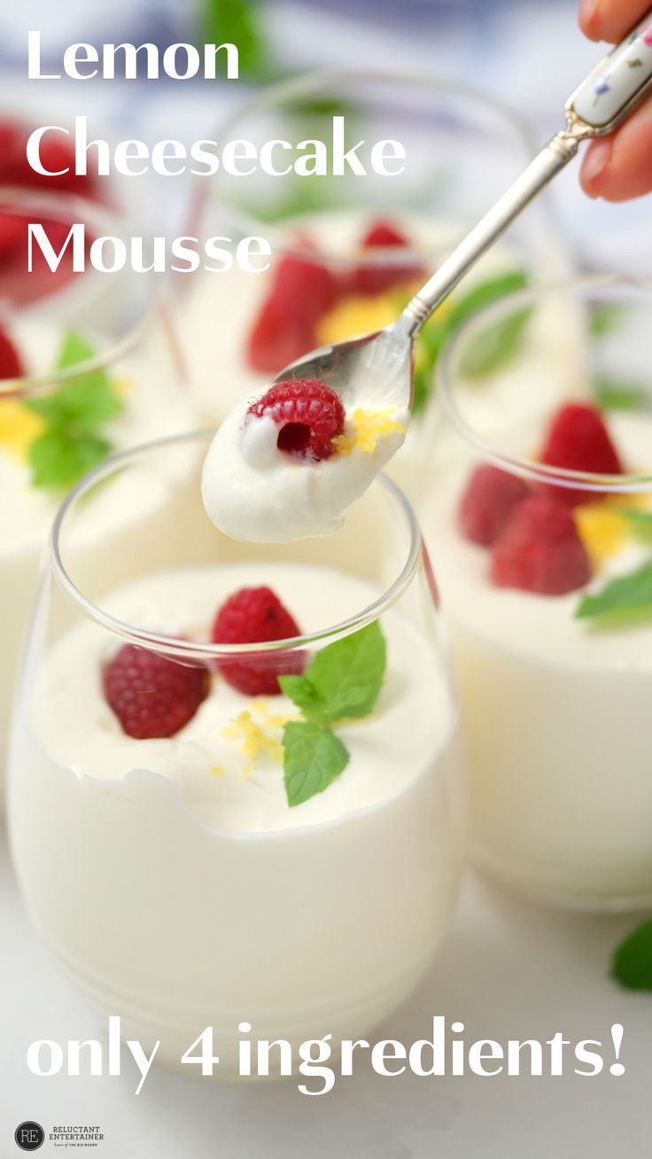 lemon cheesecake mousse with raspberries and mint leaves in small glasses