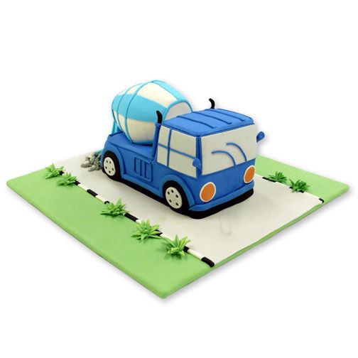 a cake shaped like a car with a surfboard on the top and palm trees around it