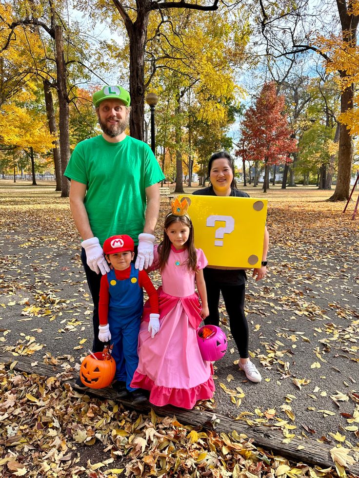 a man and two children dressed up in costumes