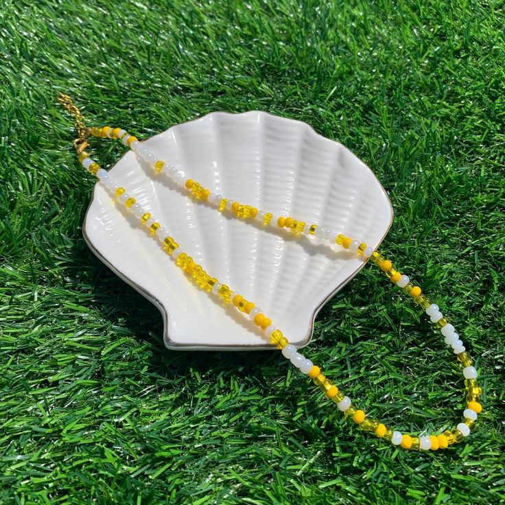 This yellow seed bead necklace is part of our spring collection! These colors are sure to give you a reminder of ice-cold lemonade! This necklace is a personal favorite! Hope you enjoy this piece as much as we do! Casual Yellow Round Bead Necklaces, Casual Yellow Beaded Necklaces With Round Beads, Casual Yellow Beaded Chain Jewelry, Trendy Yellow Round Bead Necklaces, Trendy Yellow Round Beads Necklaces, Trendy Yellow Necklaces With Round Beads, Summer Yellow Beaded Necklaces, Tiny Yellow Beads For Summer, Trendy Yellow Necklace With Tiny Beads