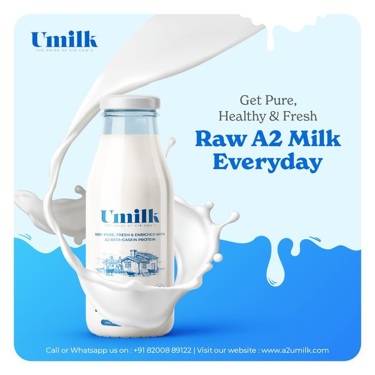 a bottle of unilk milk with splashing milk on the side and blue background