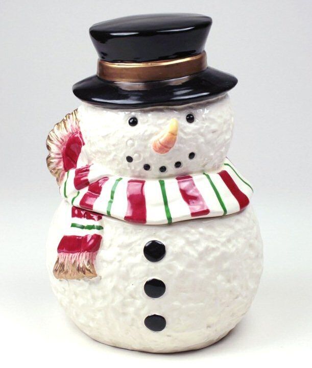 a snowman with a hat and scarf on