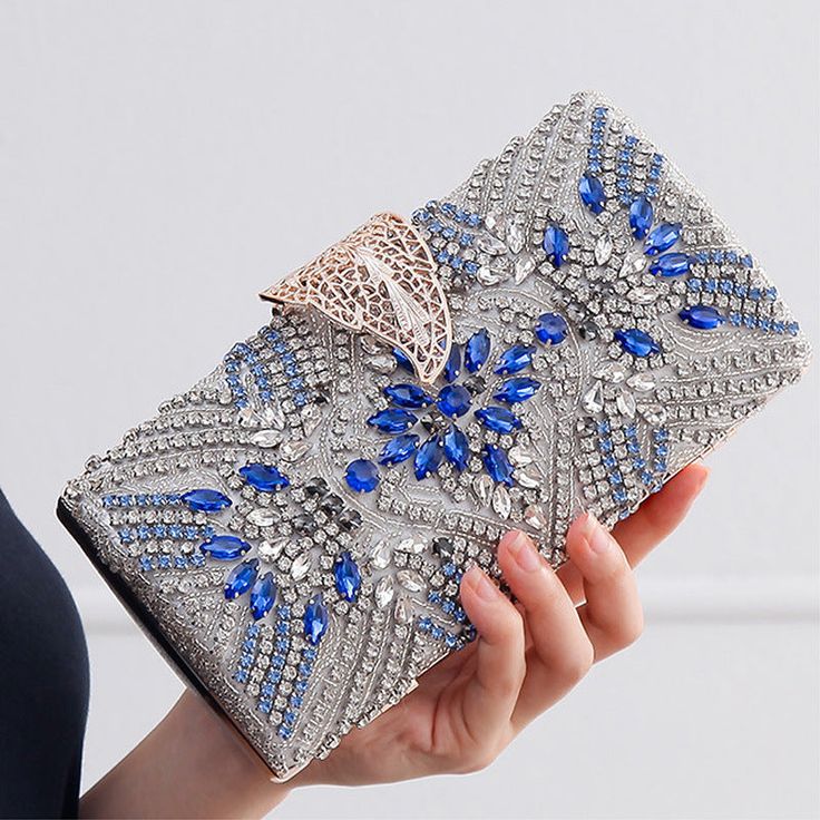 Add a touch of elegance to your evening party look with our exquisite Bridal Clutch Elegant Leaf Locker. This stunning clutch features a unique new design with intricate leaf patterns in a beautiful shade of blue, making it the perfect accessory for any bridal or special occasion outfit. Occasion Outfit, Bridal Purse, Leaf Patterns, Bridal Clutch, Special Occasion Outfits, Party Look, Bridal Hair Pieces, Bridal Jewelry Sets, Party Looks