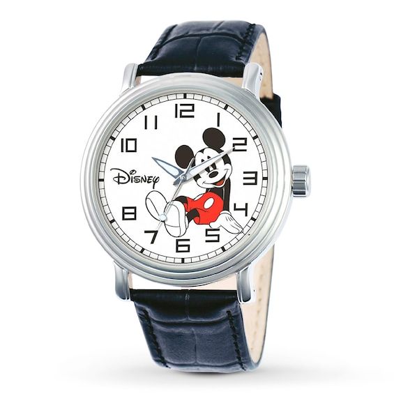 This Disney watch displays an iconic image of Mickey Mouse on a white dial. Features include silver-tone hands, black Arabic numerals and a 44mm alloy case. It has a black leather band with a buckle clasp. This watch is water-resistance tested to 30 meters. Disney Characters Minnie Mouse, Mickey Mouse Clock, Mickey Mouse Images, Mickey Mouse Watch, Disney Watches, Black Leather Watch, Watches Women Leather, Vintage Mickey Mouse, Disney Jewelry