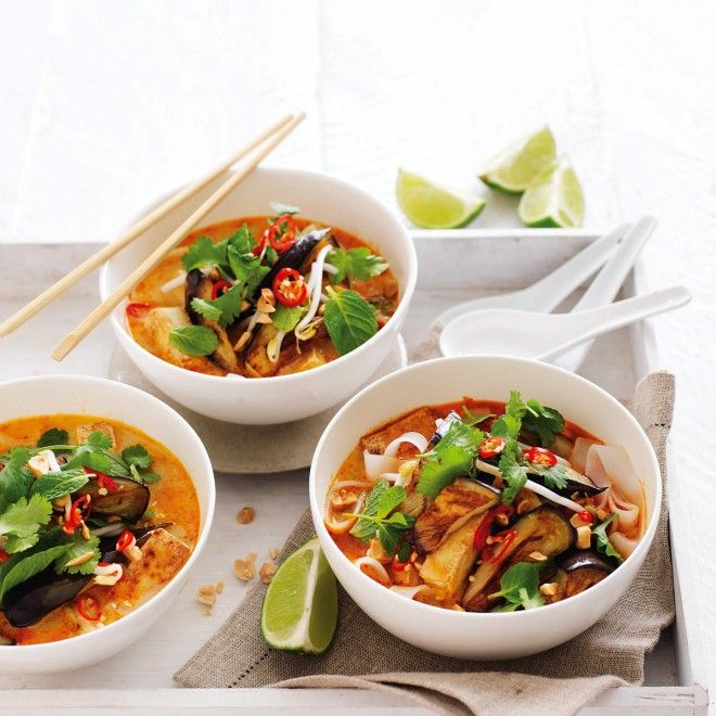 three bowls of food with chopsticks on the side