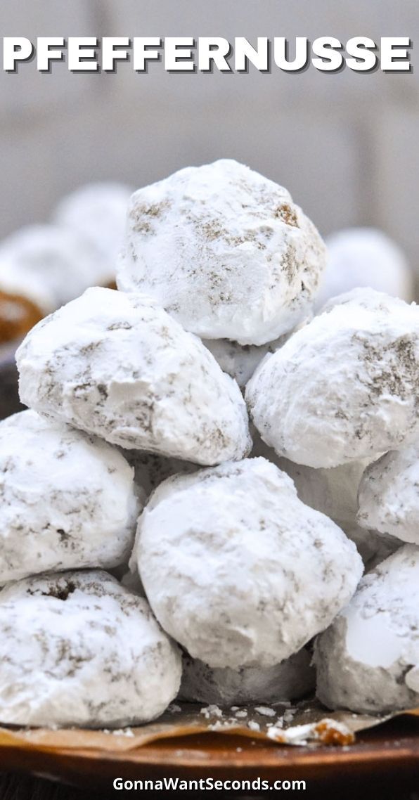 powdered sugar donuts stacked on top of each other in a bowl with text overlay