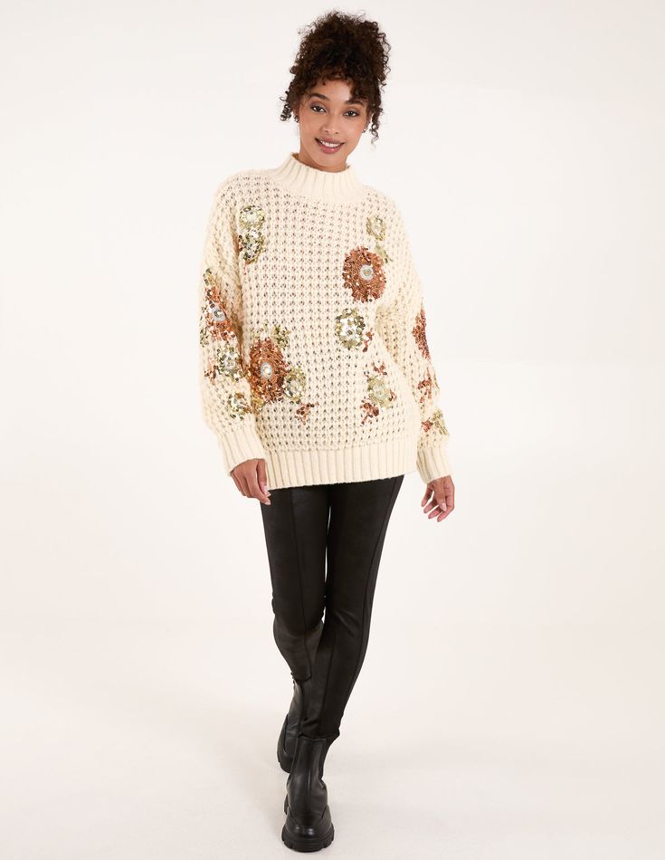 A bold chunky jumper perfect for the Christmas party season! With it's detailed sequin sleeves this jumper ensures to be a total stand out statement. 100% PolyesterMade In China Machine washableHigh neck Long sleeveUnfastenedModel wears a size: S/MModel height: 5ft 8 / 173 cm Flower Knit, Sequin Flower, Chunky Jumper, Sequin Sleeve, Boho Summer Dresses, Blouse Sale, Floral Shirt Dress, Vanilla Cream, Flower Detail