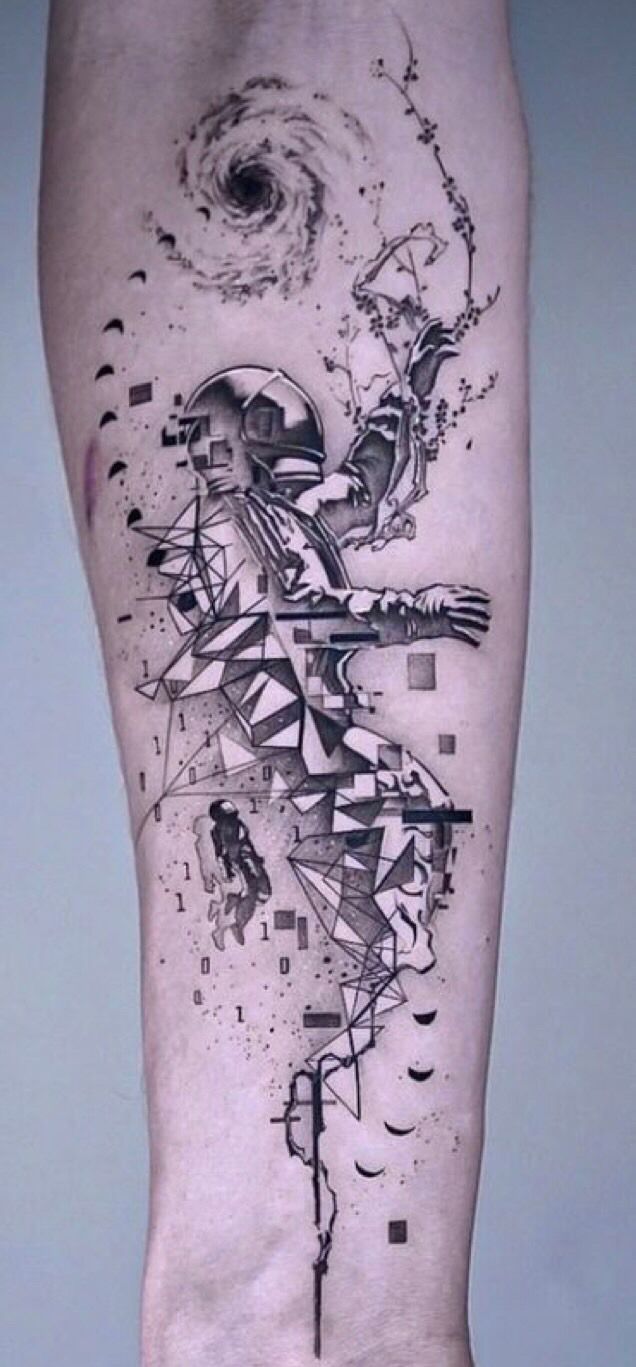 a man's leg with an abstract tattoo on it