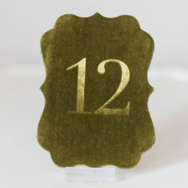 a close up of a waxed stamp with the number twelve on it