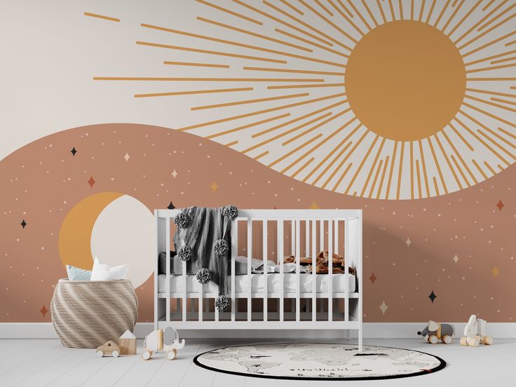 a baby's room with a crib, rug and sun mural on the wall