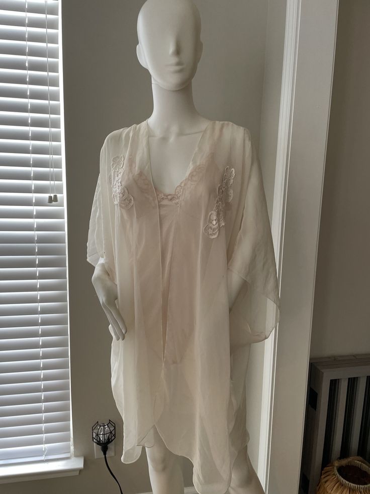 Cacique Robe Ivory Poly blend  Sz M has slight age wear and spots Due to the item being vintage small flaws are to be expected.  PLEASE USE CODE 20SALE FOR 20% OFF YOUR FIRST PURCHASE Fitted Beige V-neck Sleepwear, Cream Lace Trim Sleepwear For Summer, Summer Cream Sleepwear With Lace Trim, Cream Lace Trim Summer Sleepwear, Cream V-neck Sleepwear For Summer, Chic Beige Sleepwear For Summer, Beige Lace Trim Sleepwear For Summer, Spring Cream V-neck Sleepwear, Summer Beige Lace Trim Sleepwear