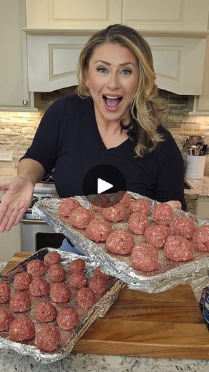 a woman is excited about the meatballs she made for her family's dinner