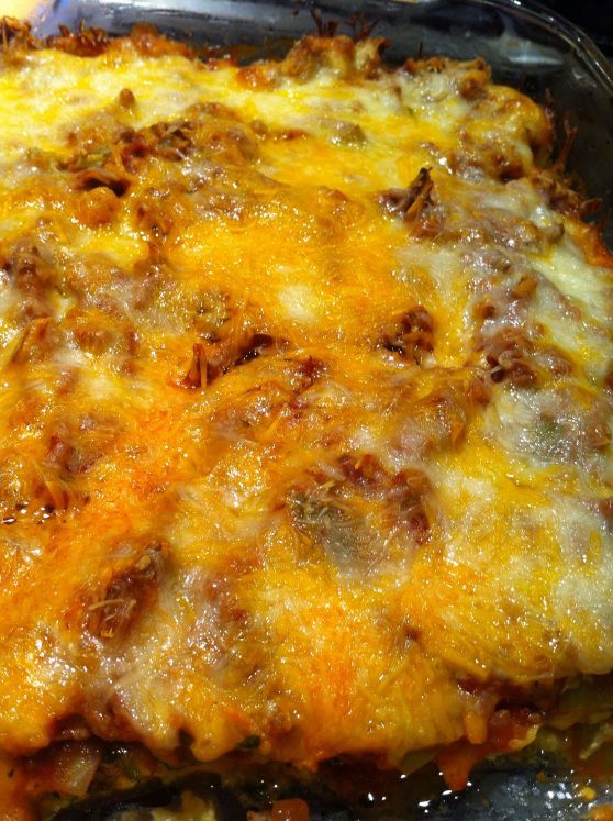 a casserole dish with meat and cheese on it