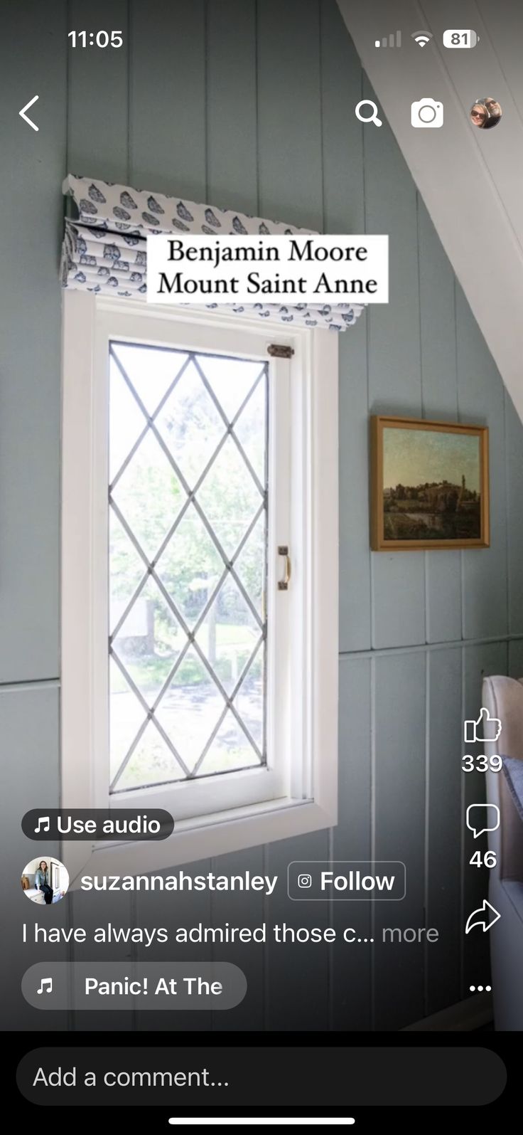 an image of a window in the corner of a room with blue walls and white trim