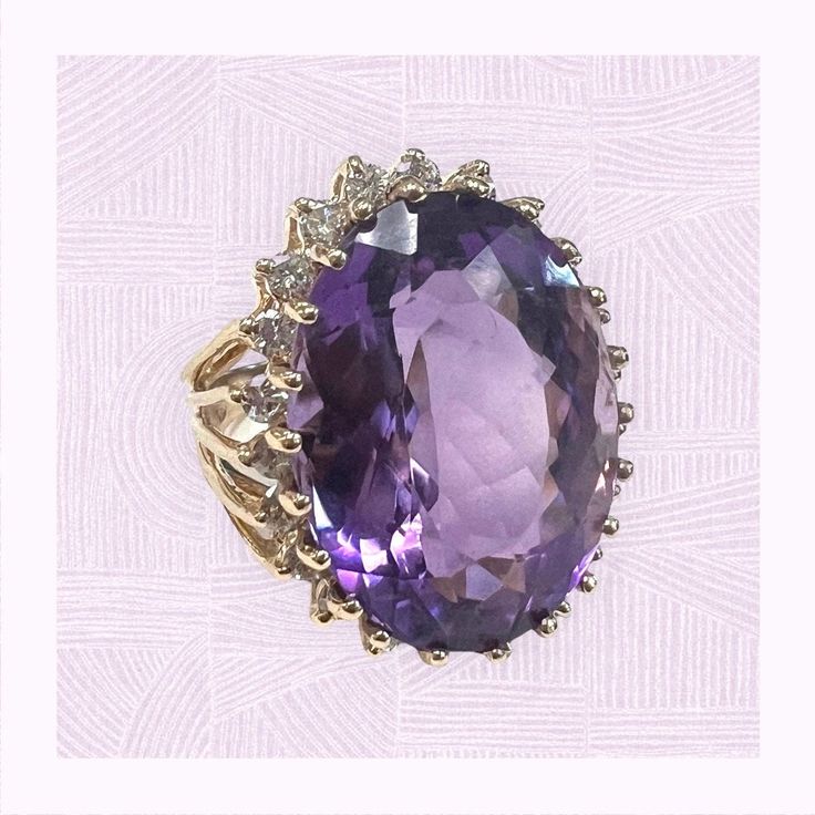 1980s Large Amethyst and Diamond Halo Ring in 14 karat yellow gold Oval Gemstones With Diamond Accents Luxury Style, Formal Oval Amethyst Gemstones, Oval Amethyst Gemstones For Formal Occasions, Elegant Gold Amethyst Ring With Diamonds, Elegant Yellow Gold Amethyst Ring With Diamond Accents, Elegant Yellow Gold Amethyst Ring With Brilliant Cut, Luxury Purple Oval Gemstones, Elegant Oval Gemstones With Diamond Accents, Luxury Oval Amethyst Jewelry