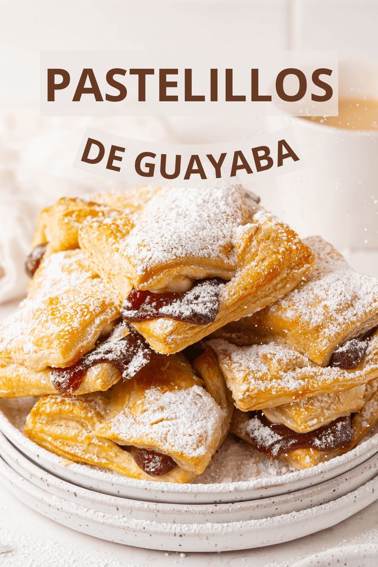 some pastries are stacked on top of each other with powdered sugar and jam