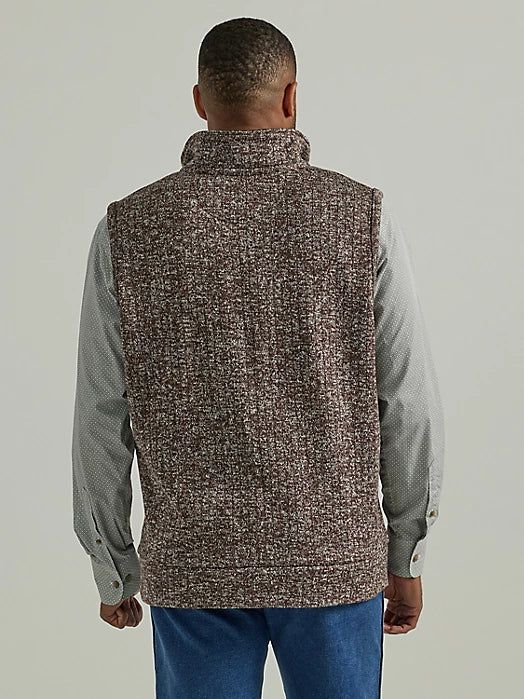 STYLISH ENOUGH FOR ANY OCCASION The elements can't compete with this George Strait knit vest. Providing warmth without the weight, this vest is a tried-and-true staple for the colder months. It comes with angled pockets at the waist as well as a hidden zippered pocket on the left side of the chest. Whether you're headed out or hanging around the ranch, this vest will quickly become your go-to for casual style and uncompromising comfort. Layer up by wearing this vest over a long sleeve tee, a but Casual Sleeveless Knit Outerwear, Knit Sweater Vest With Pockets For Winter, Knit Vest Outerwear For Layering, Sleeveless Knit Outerwear For Fall, Cotton Sweater Vest With Pockets For Winter, Casual Winter Sweater Vest With Pockets, Casual Sweater Vest With Pockets For Winter, Casual Brown Vest For Winter, Winter Sweater Vest For Cold Weather