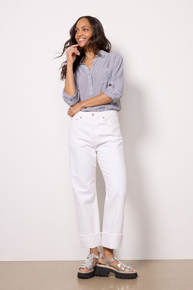 Perfect for everyday wear, these versatile AGOLDE jeans are crafted in structured cotton denim and feature a relaxed, high-rise silhouette with a button fly closure and cuffed hems. Straight Leg Jeans With Rolled Hem, Chic Workwear Jeans With Button Closure, Chic Button Closure Jeans For Work, Chic Jeans With Button Closure For Work, Relaxed Fit Cotton Jeans With Rolled Hem, Business Casual Spring Jeans With Button Closure, Chic Cotton Pants With Button Cuffs, Fall Cotton Cropped Jeans With Button Closure, Straight Leg Cropped Cotton Jeans With Button Closure