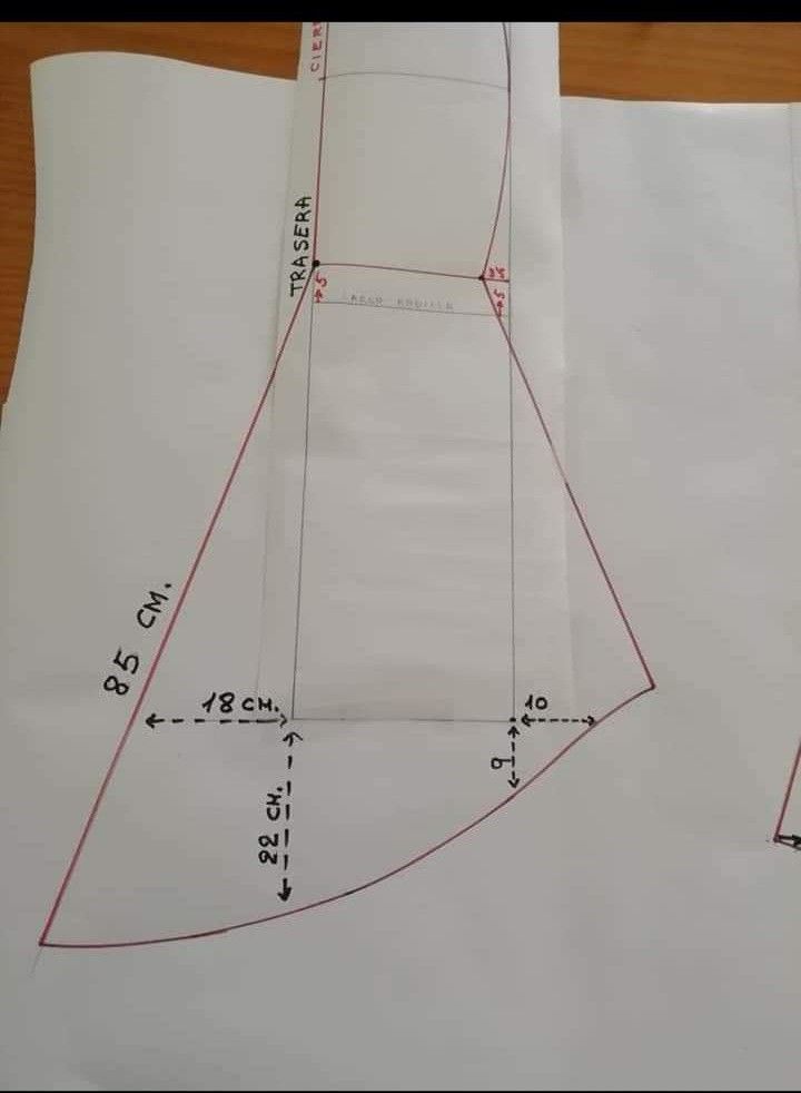 a piece of paper that has been cut out to show the pattern for a dress