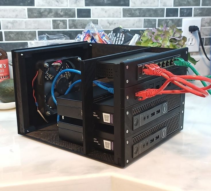 a black computer case sitting on top of a counter