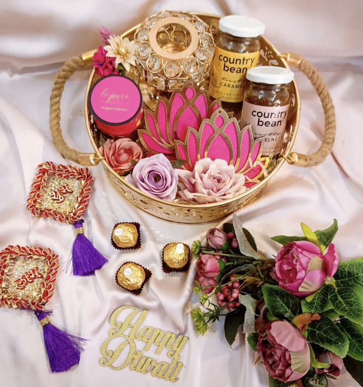 a basket filled with lots of different items on top of a white table covered in flowers