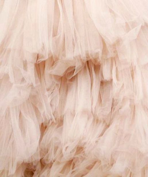 the back of a dress with ruffles is shown in this close up photo