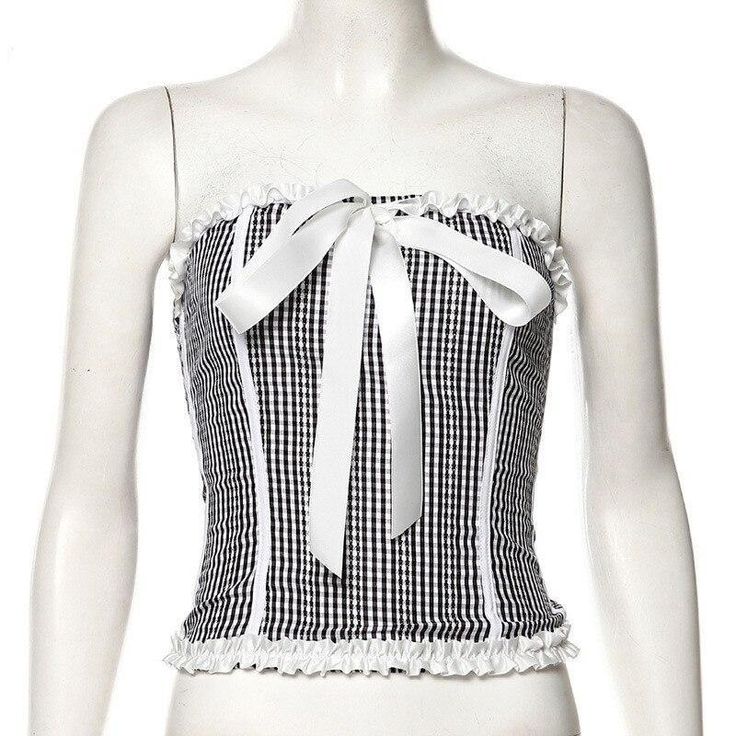 This corset features a large ribbon band on the neckline. Mother-of-pearl button fastening.[custom tab] FABRIC #1: 87% SILK 13% POLYESTER | LINING #1: 100% POLYESTER[/custom tab] Fitted Party Tops With Ribbon, Party Corset With Tie Straps, Chic Fitted Top With Ribbon, Summer Fitted Tops With Ribbon, Fitted Summer Tops With Ribbon, Fitted Summer Tops With Ribbon Detail, Chic Fitted Corset With Tie Straps, Chic Fitted Ribbon Tops, Chic Summer Overbust Corset Belt