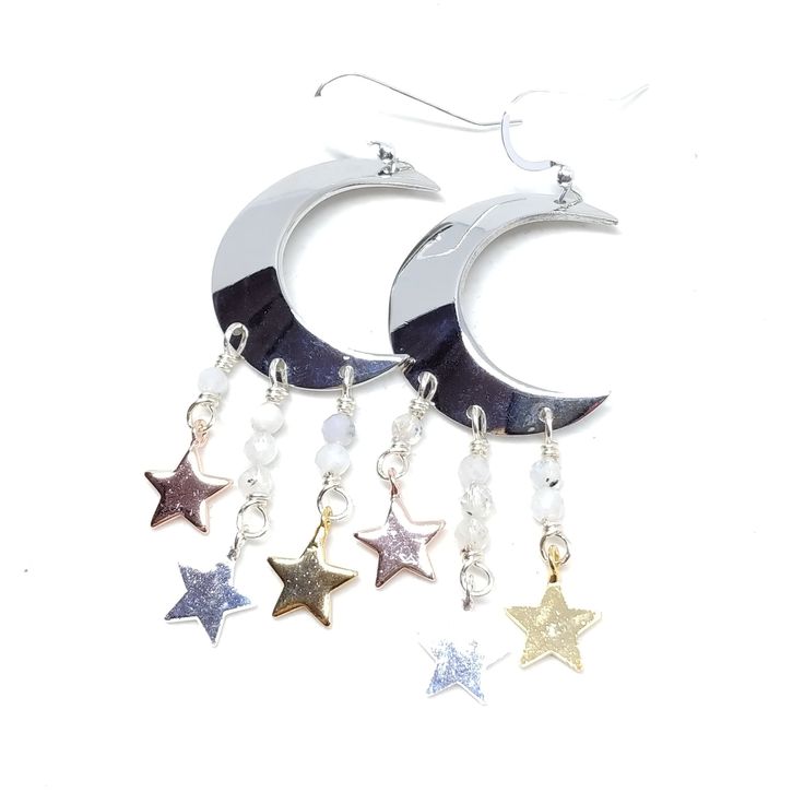 You were born with the imprint of the moon and stars on your soul. Show your ties to the ethereal night sky with these sparkling moon and star earrings! These earrings dangle 2 3/4". Sterling silver ear wires, rhodium plated moons, moonstones. To keep these moon and stars bright and shiny, I recommend a Sunshine Polishing Cloth! Celestial Silver Moonstone Earrings, Silver Dangle Moonstone Crystal Earrings, Celestial White Sterling Silver Earrings, Silver Moonstone Dangle Crystal Earrings, White Sterling Silver Celestial Earrings, Handmade Silver Cosmic Jewelry, Silver Moon Phase Drop Earrings, Silver Mystical Jewelry With Ear Wire, Celestial Sterling Silver Earrings