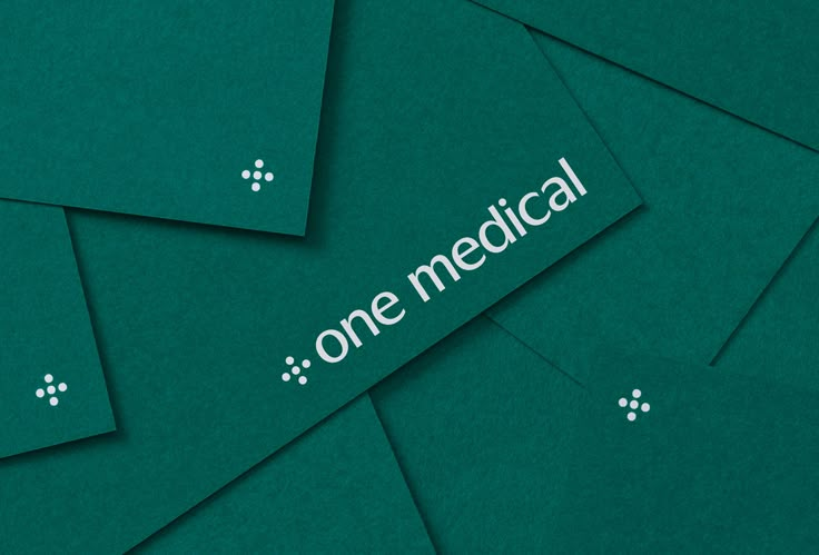 several pieces of green paper with the words one medical on them