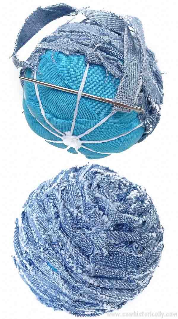 two balls of blue yarn are next to each other on a white background, with one ball wrapped in silver thread