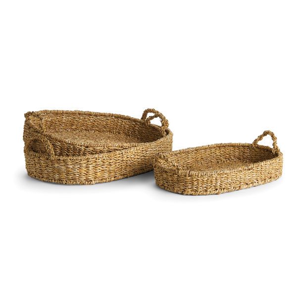 two woven baskets with handles on white background