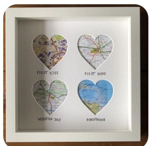 three heart shaped maps are displayed in a white shadow box with the words first kiss, first home, and third day