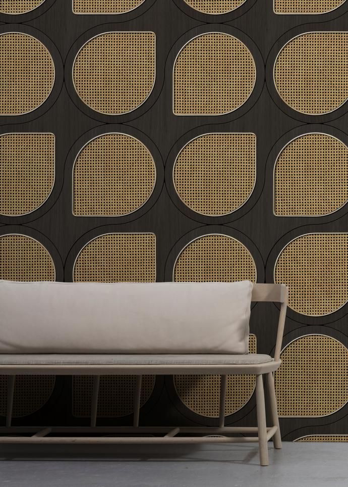 a bench sitting in front of a wall with circles on it's back side