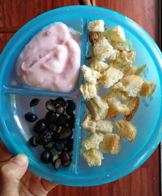 a blue plate topped with different types of food