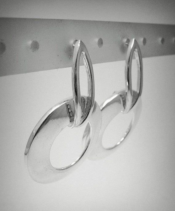 Sterling silver earrings 925/1000. Stamped 925.Approximate weight 8.9 grams. DIAMETER 3.6CM All our jewels are made from solid sterling silver 925/1000 and are carefully crafted by hand in our family workshop. We dispatch your orders in 5 working days, worldwide and the postage is $5. We ship registered priority mail. Please allow 5-7 working days for delivery in Europe and 10-15 working days outside Europe. For any questions - please do not hesitate to contact me! Modern Sterling Silver Clip-on Earrings For Formal Occasions, Oval Sterling Silver Earrings With Polished Finish, Sterling Silver Polished Anniversary Earrings, Minimalist Silver Sterling Clip-on Earrings, Sterling Silver Earrings With Polished Finish For Anniversary, Minimalist Silver Earrings With Sterling Silver Clasp, Sterling Silver Polished Earrings For Anniversary, Silver Hallmarked Minimalist Earrings, Silver Minimalist Hallmarked Earrings